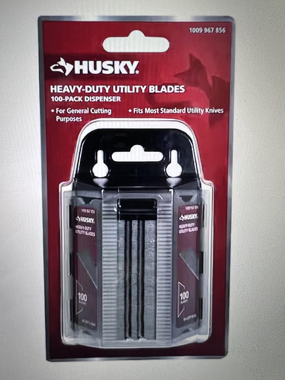 Набор сталевих універсальних лез Husky (100 шт.) у диспенсері.