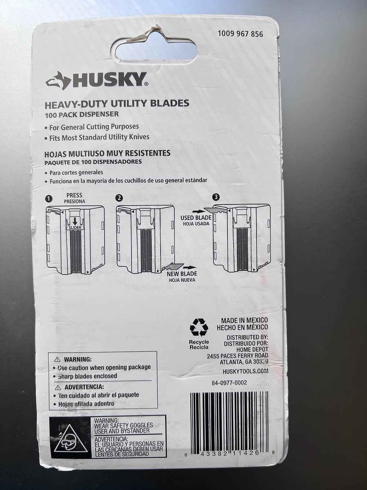 Набор сталевих універсальних лез Husky (100 шт.) у диспенсері.